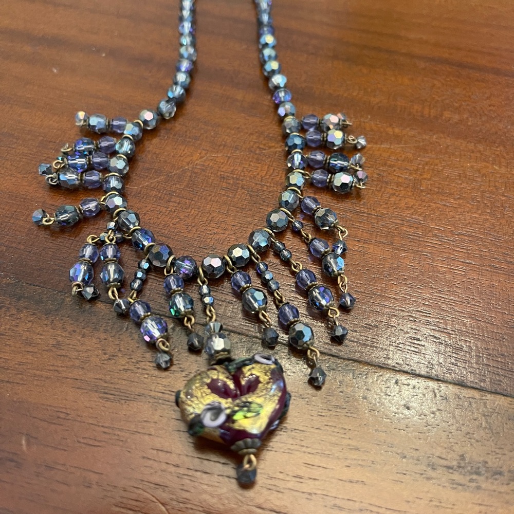 Lady rads antique necklace